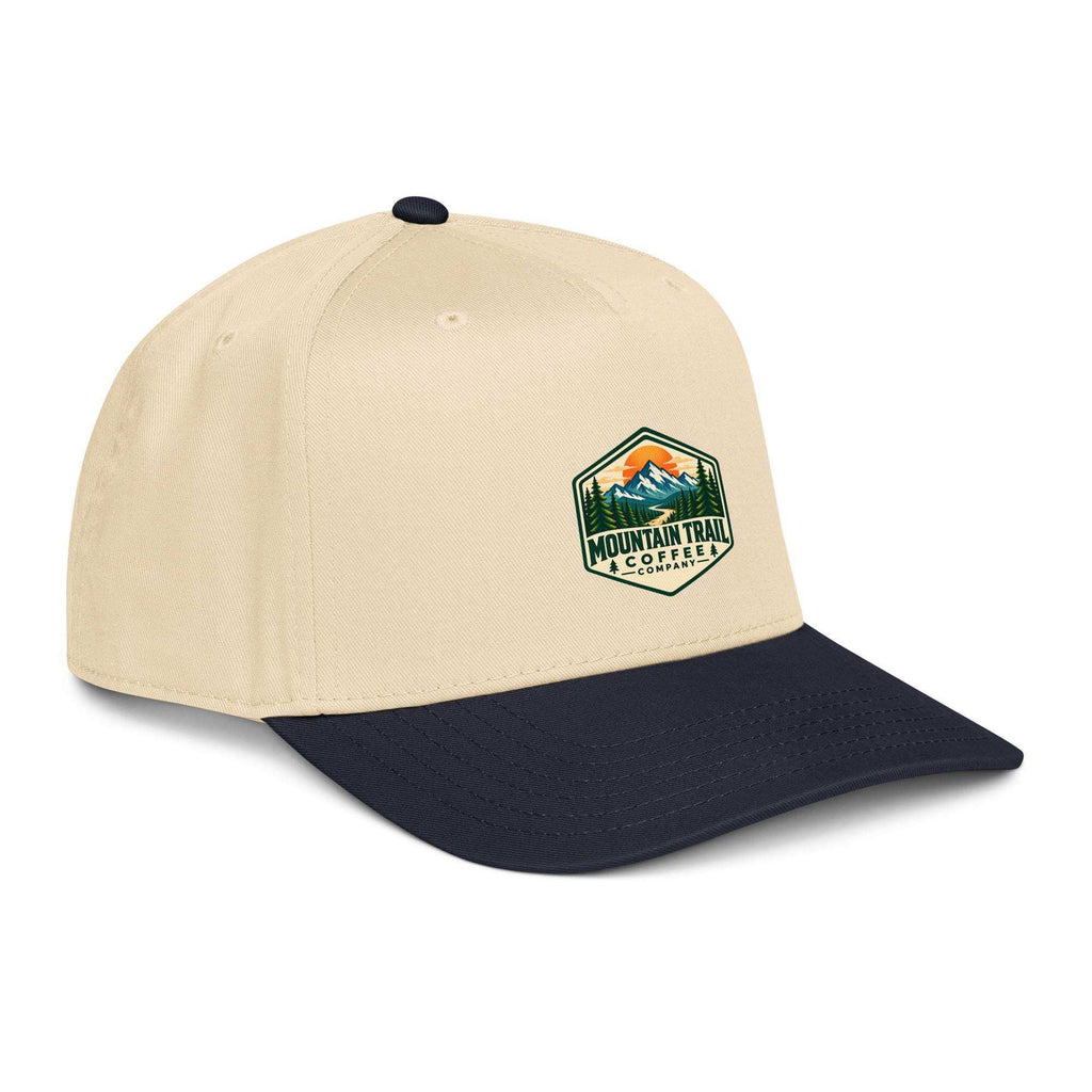 5 panel cap in beige cotton blend with navy curved brim and embroidered Mountain Trail Coffee patch