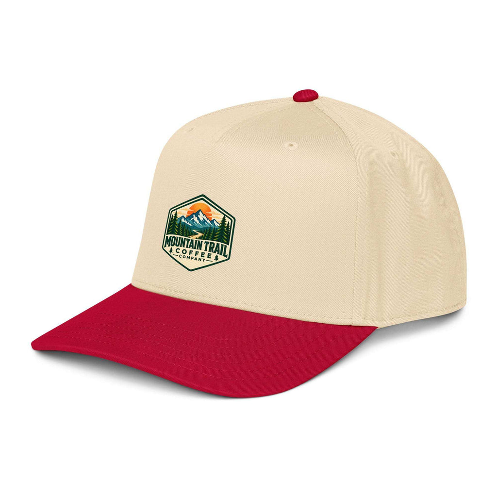 5 panel cap in cream cotton blend with red curved visor, red top button, and mountain trail coffee patch